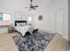 Main bedroom with ceiling fan and en-suite bathroom at 632 Kermarah Ave, Haines City, FL 33844