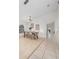 Bright dining room with light wood floors and a modern table at 632 Kermarah Ave, Haines City, FL 33844