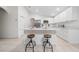 Kitchen island with quartz countertops and wooden stools at 632 Kermarah Ave, Haines City, FL 33844