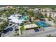 Aerial view of community with pool, courts, and clubhouse at 8059 King Palm Cir, Kissimmee, FL 34747