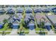 Solar-paneled house in a neighborhood with pools and lush landscaping at 8059 King Palm Cir, Kissimmee, FL 34747