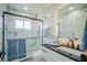 Modern bathroom with marble tile and glass shower at 8059 King Palm Cir, Kissimmee, FL 34747