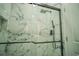 Modern shower with marble tile and glass enclosure at 8059 King Palm Cir, Kissimmee, FL 34747