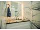 Clean bathroom with marble tile and modern fixtures at 8059 King Palm Cir, Kissimmee, FL 34747