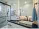 Modern bathroom with marble tile and glass shower at 8059 King Palm Cir, Kissimmee, FL 34747
