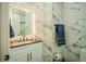 Elegant bathroom with marble tile and modern vanity at 8059 King Palm Cir, Kissimmee, FL 34747