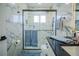 Modern bathroom with marble tile and glass shower at 8059 King Palm Cir, Kissimmee, FL 34747