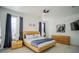 Large bedroom with modern wood platform bed and ensuite bathroom at 8059 King Palm Cir, Kissimmee, FL 34747