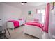 bedroom with twin beds and pink bedding at 8059 King Palm Cir, Kissimmee, FL 34747