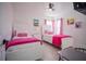 bedroom with twin beds and pink bedding at 8059 King Palm Cir, Kissimmee, FL 34747