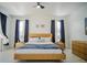 Spacious bedroom with a king-size bed, wood accents, and plenty of natural light at 8059 King Palm Cir, Kissimmee, FL 34747