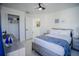 Bedroom with a queen bed, closet, and window at 8059 King Palm Cir, Kissimmee, FL 34747
