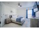 Guest bedroom with a queen bed and window at 8059 King Palm Cir, Kissimmee, FL 34747