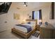 Spacious bedroom with wood furniture and large windows at 8059 King Palm Cir, Kissimmee, FL 34747