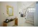 Bright and spacious entryway with modern staircase, leading to kitchen and living area at 8059 King Palm Cir, Kissimmee, FL 34747