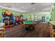 Community game room with arcade games, pool table, and air hockey at 8059 King Palm Cir, Kissimmee, FL 34747