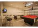 Game room with pool table, air hockey, and bar at 8059 King Palm Cir, Kissimmee, FL 34747