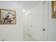 Bright hallway with artwork and doors at 8059 King Palm Cir, Kissimmee, FL 34747