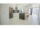 Modern kitchen featuring stainless steel appliances and a large island at 8059 King Palm Cir, Kissimmee, FL 34747