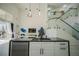 Modern kitchen with a large island, white cabinets, and black countertops at 8059 King Palm Cir, Kissimmee, FL 34747