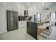 Sleek kitchen with stainless steel appliances and white cabinetry at 8059 King Palm Cir, Kissimmee, FL 34747