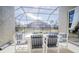 Patio with table and chairs, screened-in pool view at 8059 King Palm Cir, Kissimmee, FL 34747