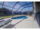 Screened-in pool and lounge chairs at 8059 King Palm Cir, Kissimmee, FL 34747