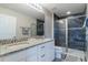 Bathroom with double vanity, granite countertop and large walk-in shower at 8127 Cadman St, Orlando, FL 32832