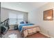 Cozy bedroom with a double bed and window blinds at 8127 Cadman St, Orlando, FL 32832