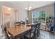 Bright dining room with blue accent wall, wooden table, and six chairs at 8127 Cadman St, Orlando, FL 32832