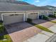 Attached garages with brick paver driveway at 8127 Cadman St, Orlando, FL 32832