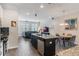 Modern kitchen with white cabinets, granite island, and stainless steel appliances at 8127 Cadman St, Orlando, FL 32832