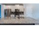 Modern kitchen with white cabinets, granite island, and stainless steel appliances at 8127 Cadman St, Orlando, FL 32832