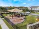 Community playground with shade structure and playset at 8127 Cadman St, Orlando, FL 32832