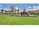 Community playground with play structures and shaded seating at 8127 Cadman St, Orlando, FL 32832