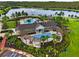 Community pool, clubhouse, and surrounding landscape at 8127 Cadman St, Orlando, FL 32832