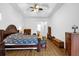 Bright bedroom with wood flooring and king-size bed at 11538 Delwick Dr, Windermere, FL 34786