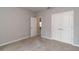 Bright bedroom with carpet flooring and double door closet at 14 Guava Terrace Trak, Ocklawaha, FL 32179