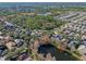 Community overview with pond and homes at 1592 Lincolnshire Drive, Deland, FL 32724