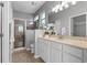 Bathroom with a walk-in shower and double vanity at 1592 Lincolnshire Drive, Deland, FL 32724