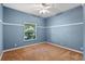 Simple bedroom with light blue walls and carpet flooring at 1592 Lincolnshire Drive, Deland, FL 32724