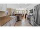 Bright kitchen with stainless steel appliances and views to dining area at 1592 Lincolnshire Drive, Deland, FL 32724