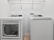 Bright laundry room with side-by-side washer and dryer at 1592 Lincolnshire Drive, Deland, FL 32724