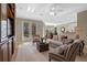 Comfortable living room featuring hardwood floors and built-in shelving at 1592 Lincolnshire Drive, Deland, FL 32724
