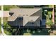 Dark brown roof, two-story house, backyard, and surrounding landscape at 1722 Farmstead Ln, Oviedo, FL 32765