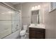Clean bathroom with a shower/tub combo and dark vanity at 1722 Farmstead Ln, Oviedo, FL 32765