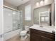 Clean bathroom with shower/tub combo and dark vanity at 1722 Farmstead Ln, Oviedo, FL 32765
