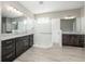 Double vanity bathroom with large walk-in shower at 1722 Farmstead Ln, Oviedo, FL 32765