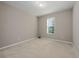 Spacious bedroom with neutral walls and carpet flooring at 1722 Farmstead Ln, Oviedo, FL 32765