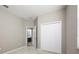 Bedroom with an ensuite bathroom and double doors at 1722 Farmstead Ln, Oviedo, FL 32765